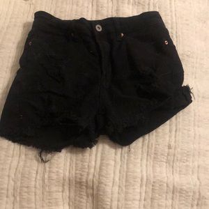 Ripped cutoff black jean shorts
